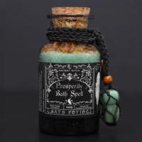 Prosperity bath potion with aventurine amulet